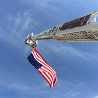 WVFC Tower 1 flying flag on extended ladder